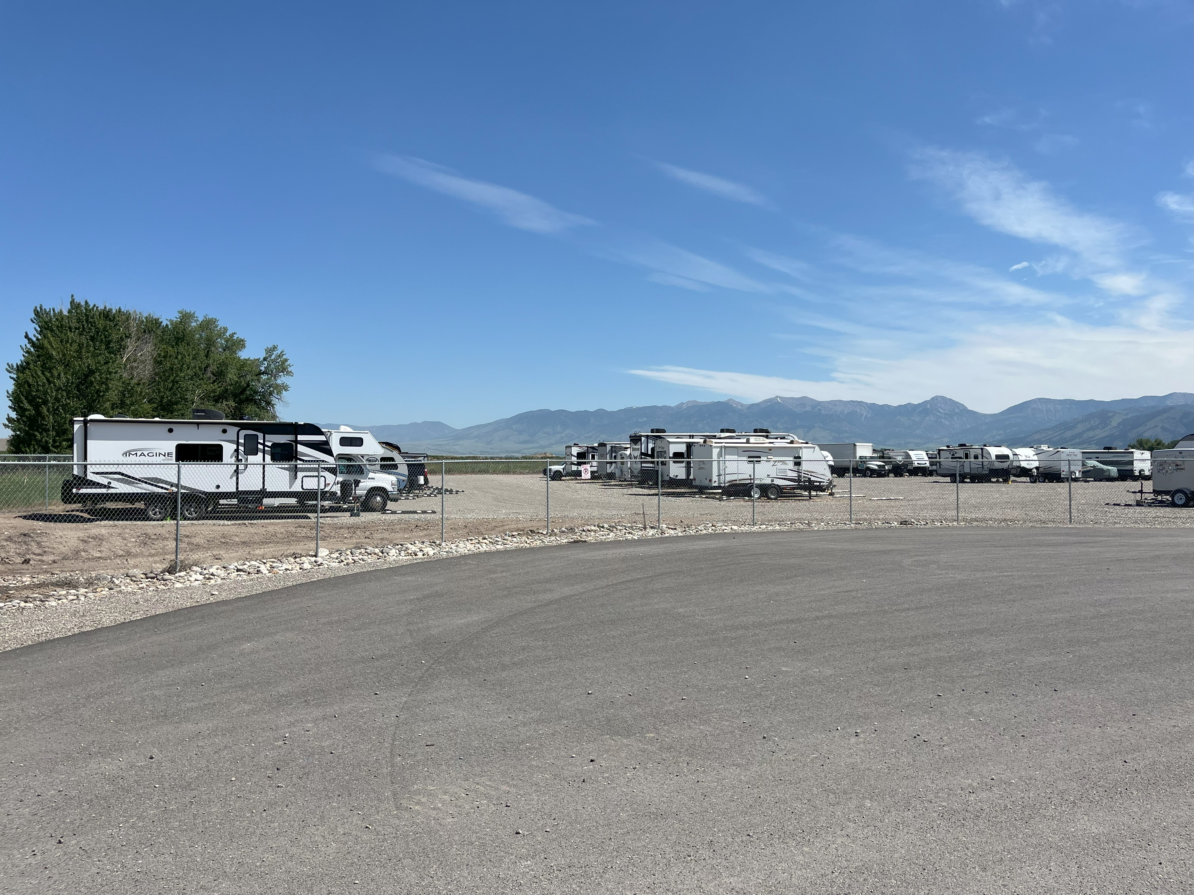 yellowstone airport storage outdoor parking area with rvs, campers, trailers, and cars